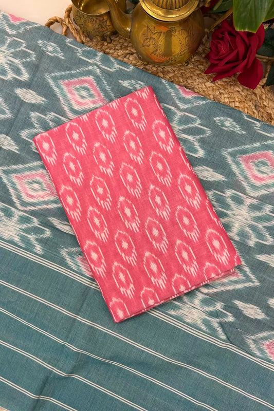 Teal and pink Ikkat cotton suit set with handwoven kurta fabric, matching dupatta and bottom featuring resist-dyed motifs.