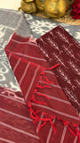 Handloom grey and maroon Ikkat cotton dupatta with striped borders and tassel detailing.
