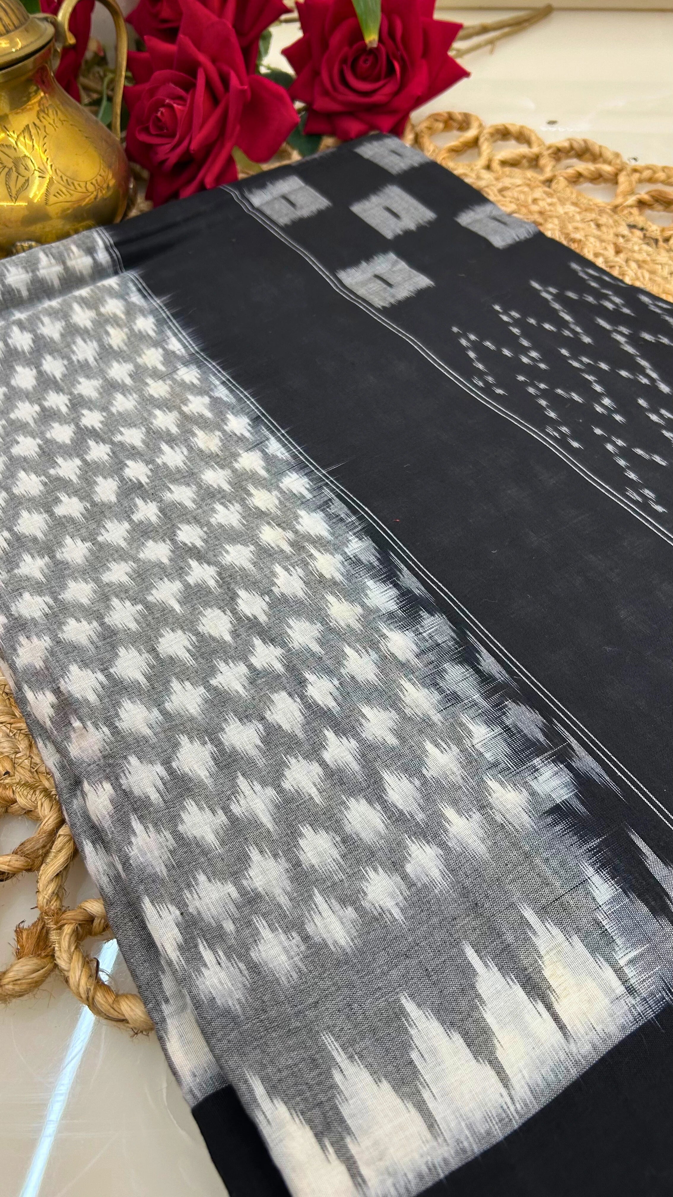 Close-up of black and grey Ikkat cotton handloom saree