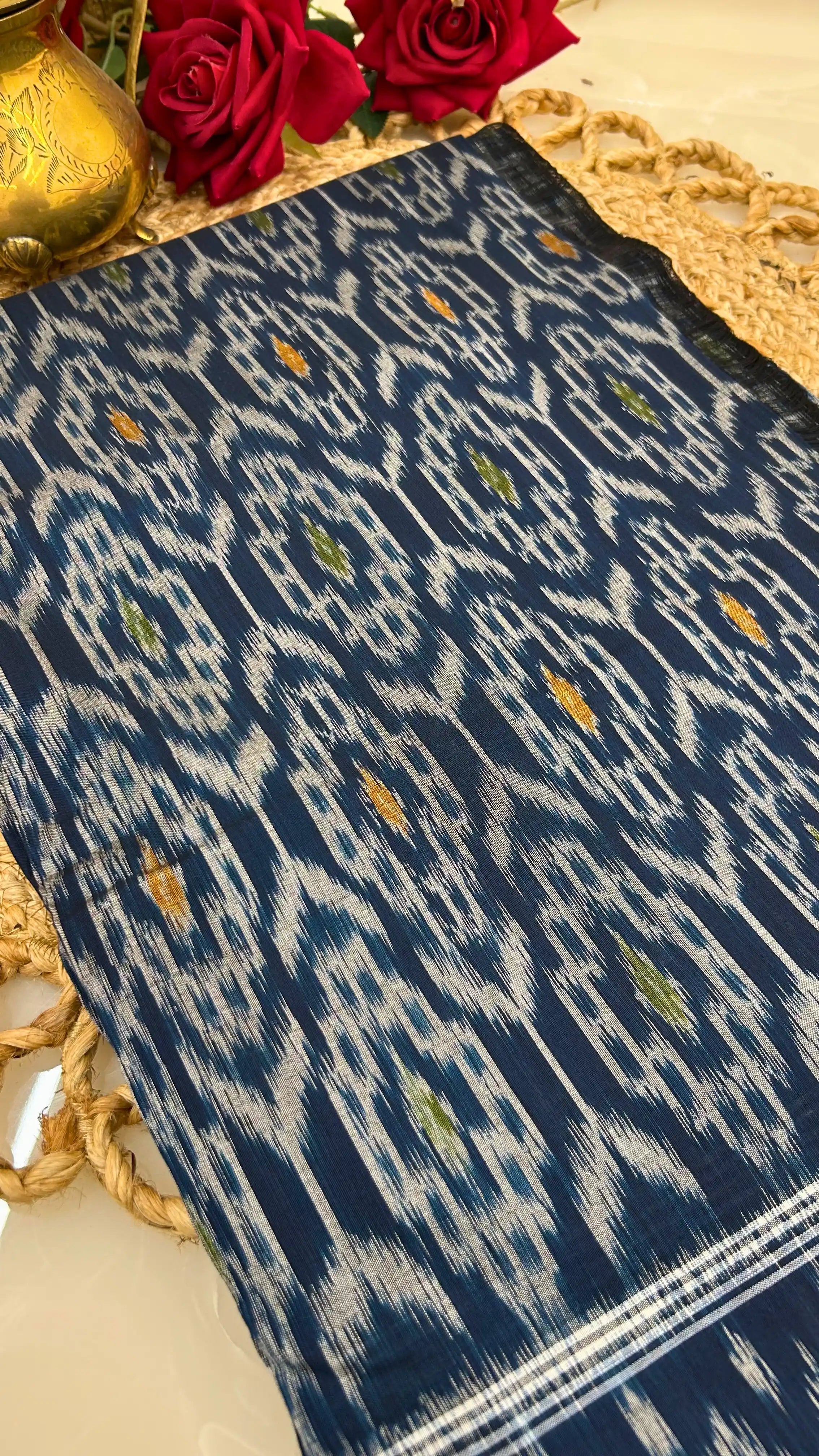 Deep blue handloom Ikkat cotton saree fabric with resist-dyed patterns