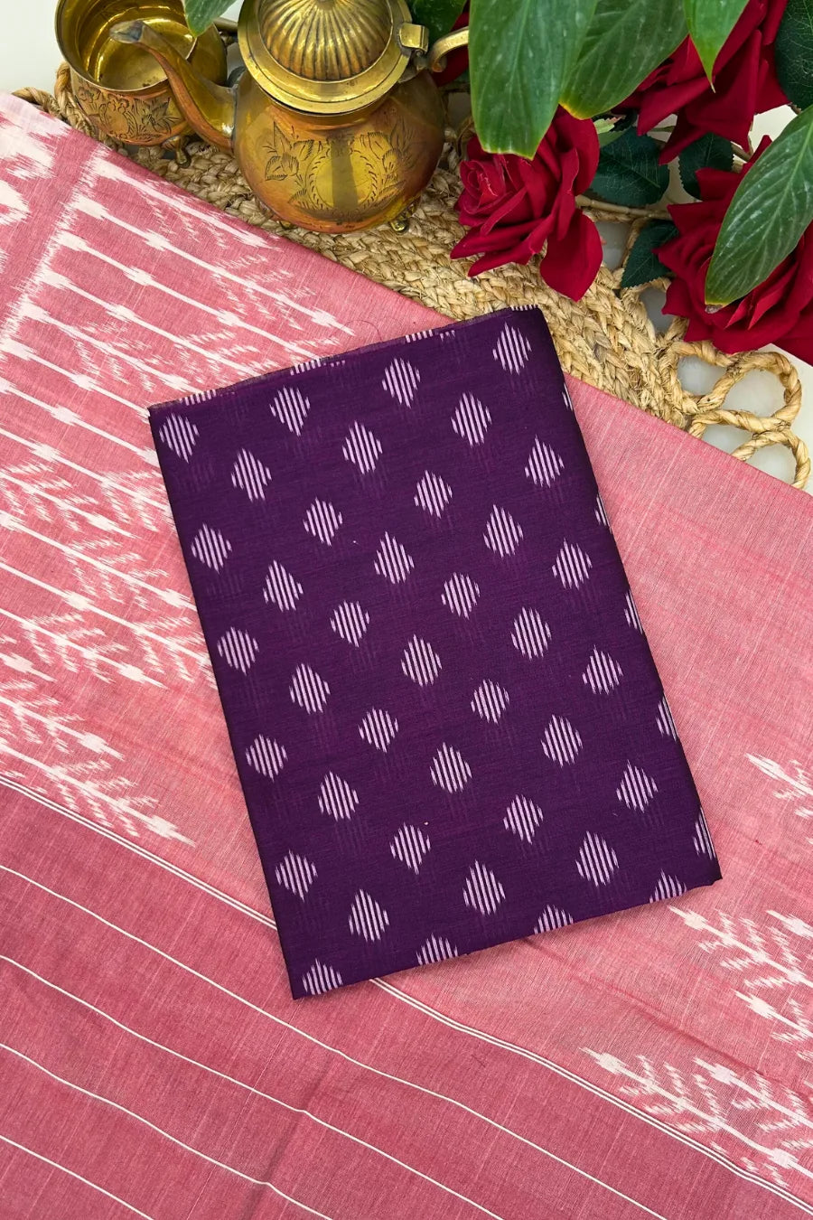 Purple and rose Ikkat cotton suit set with handwoven kurta fabric, matching dupatta and bottom featuring resist-dyed motifs.