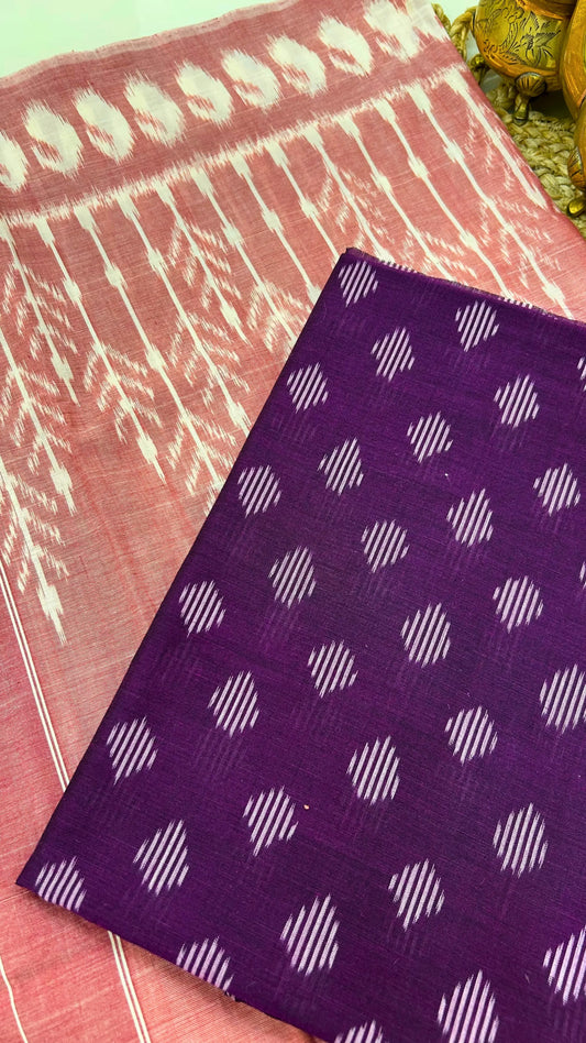 Close-up of purple Ikkat cotton fabric with traditional resist-dyed geometric motifs.