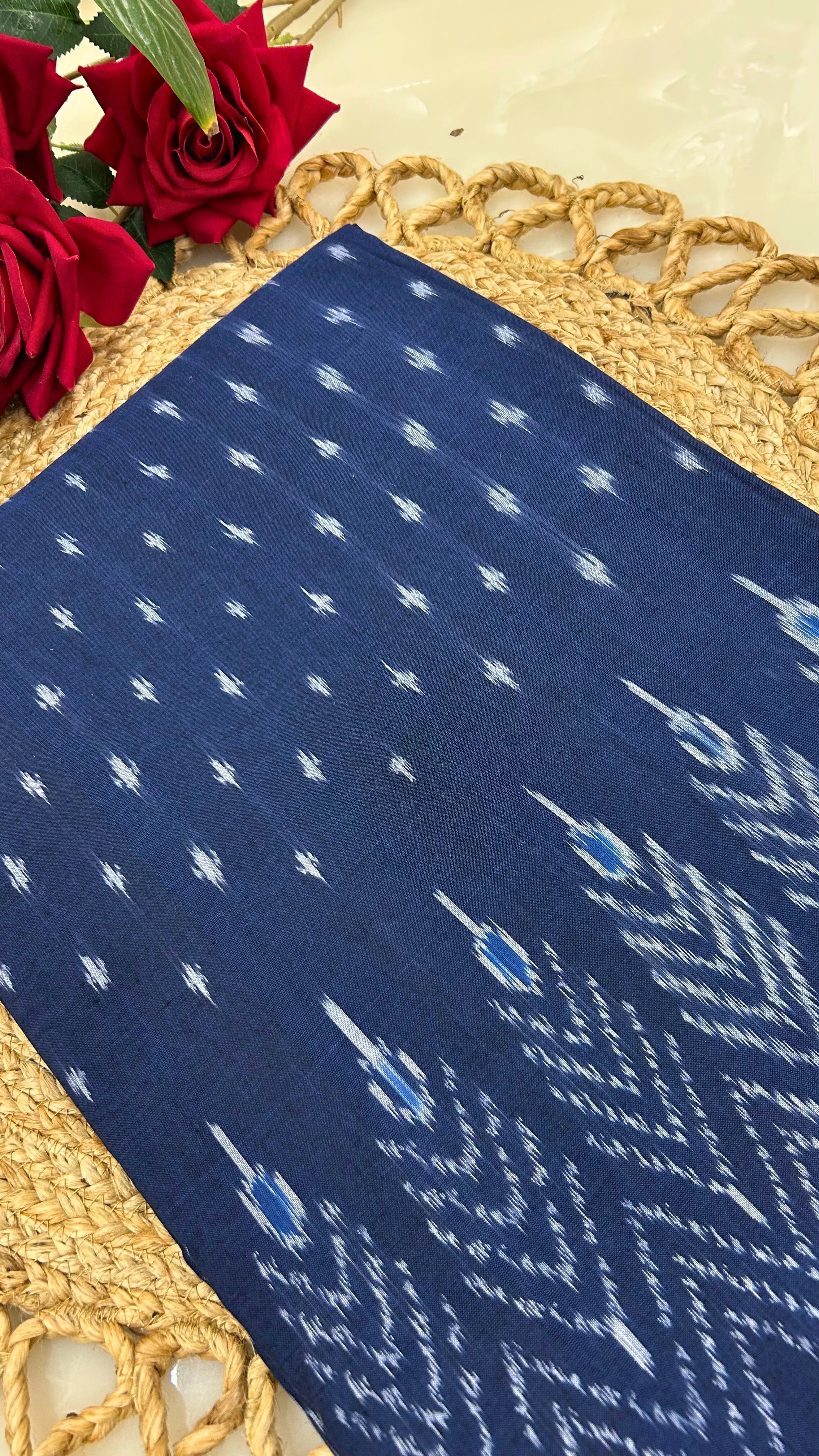 Close-up of handloom Ikkat cotton fabric with geometric weave