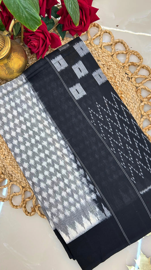 Black and grey handloom Ikkat cotton saree folded display