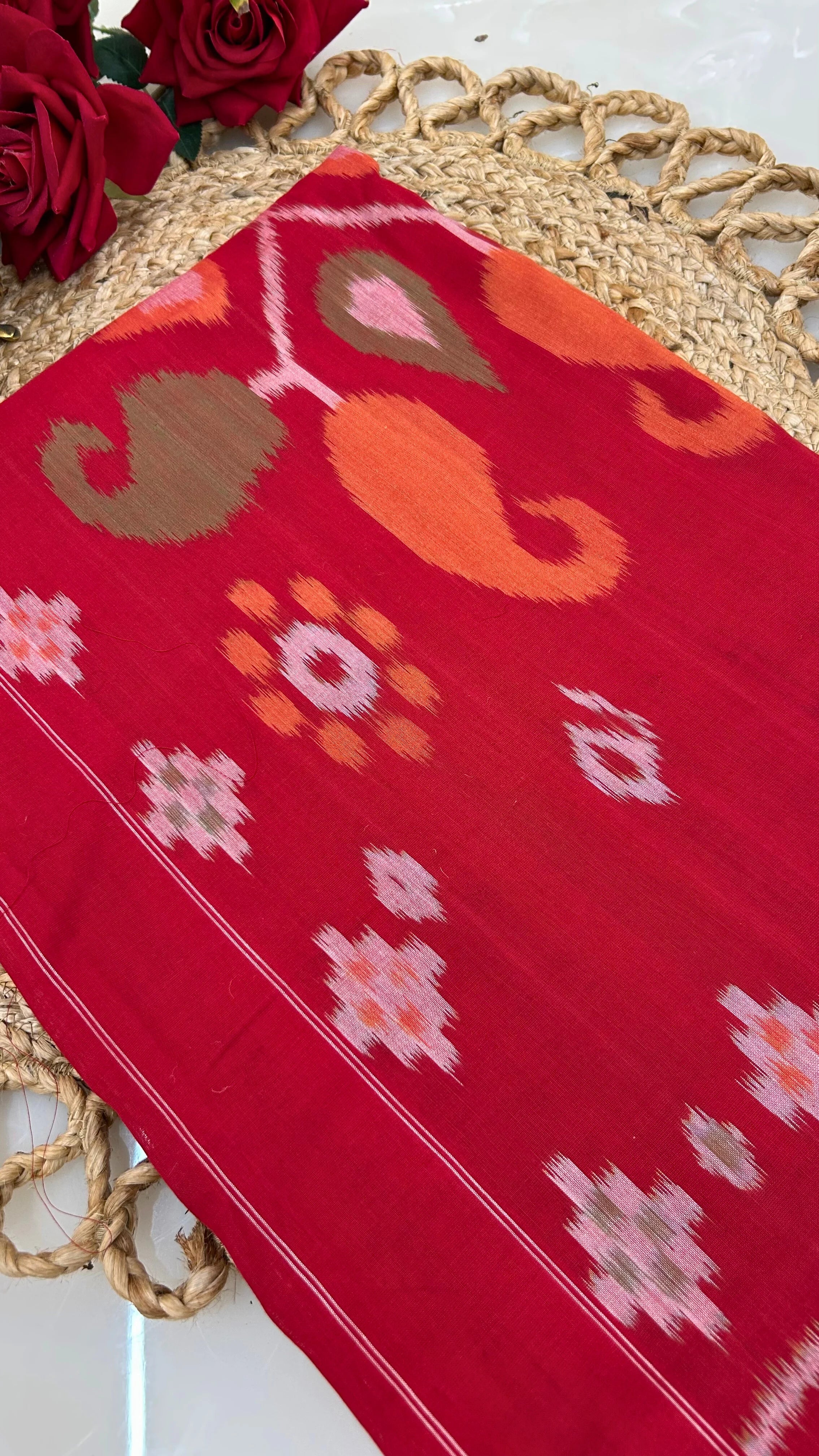 Red handloom Ikkat cotton saree fabric with resist-dyed motifs